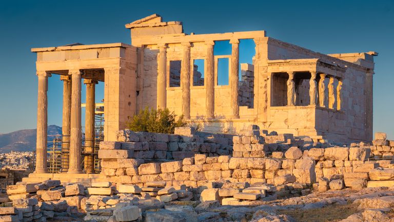 Sunlit Erechtheion Temple showcasing ancient Greek architecture on Athens' Acropolis.